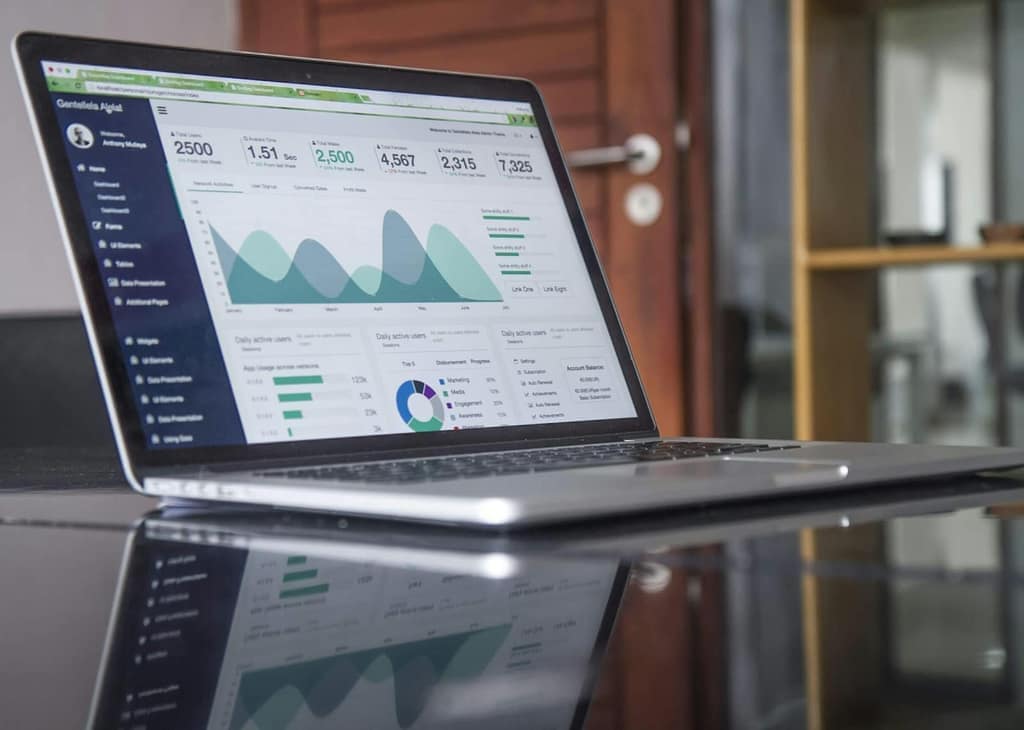 Dashboard with community metrics on a laptop screen